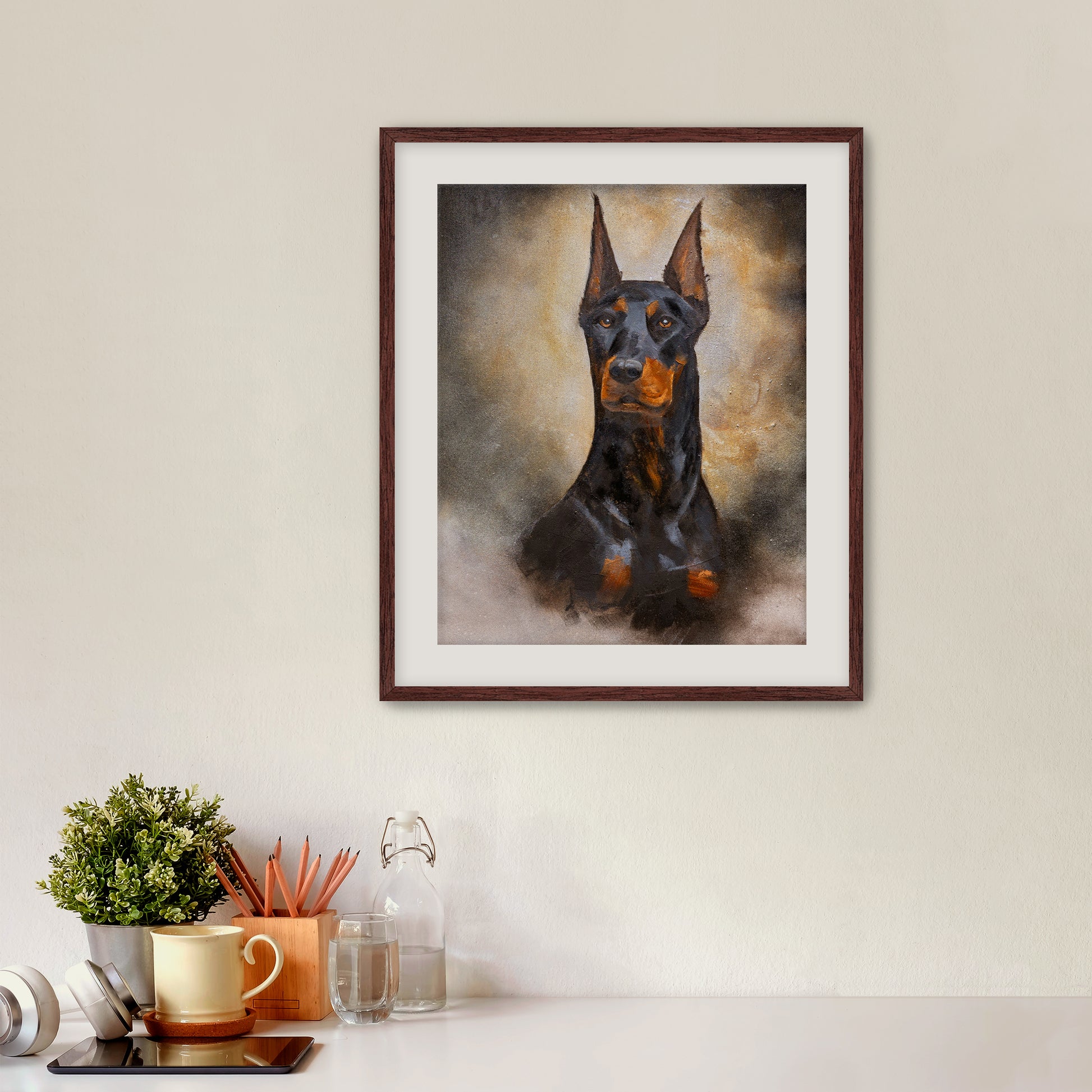 Framed artwork of a dog on a wall above a desk with office supplies.